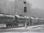Tank cars on Q608 as it heads north to Atlanta in the snow after meeting Q615 at Gabbetville Siding